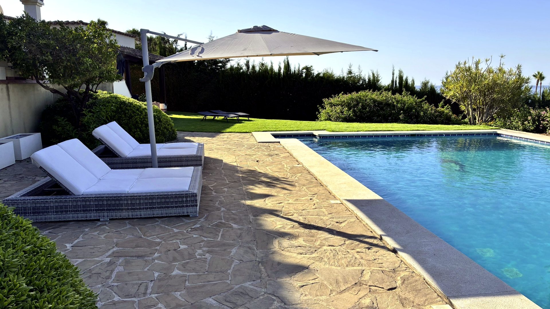 Pool and sun loungers at Bluehorizon Alcaidesa